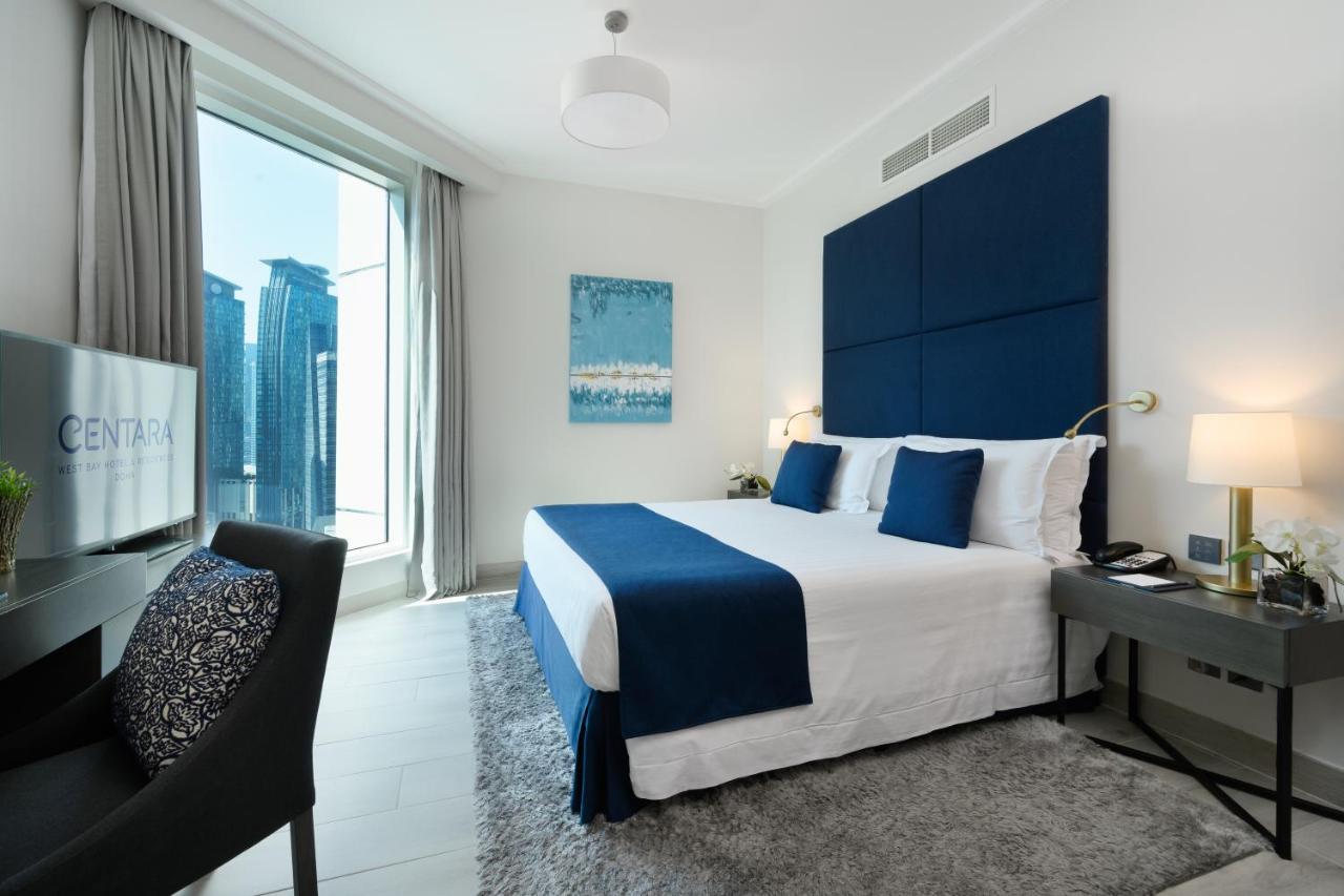 Centara West Bay Hotel & Residences 多哈 外观 照片 A bedroom at the Address Downtown Hotel